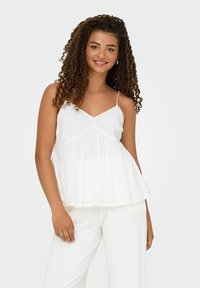 Witte camisole met dunne bandjes, V-hals en een geraffineerde taille. Bevat geborduurde accenten, zachte textuur en een vloeiende silhouet.