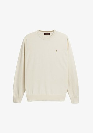 Maglione beige lavorato a maglia con scollo rotondo, polsini e orlo a coste. Presenta un piccolo logo ricamato sul petto. Tessuto morbido.