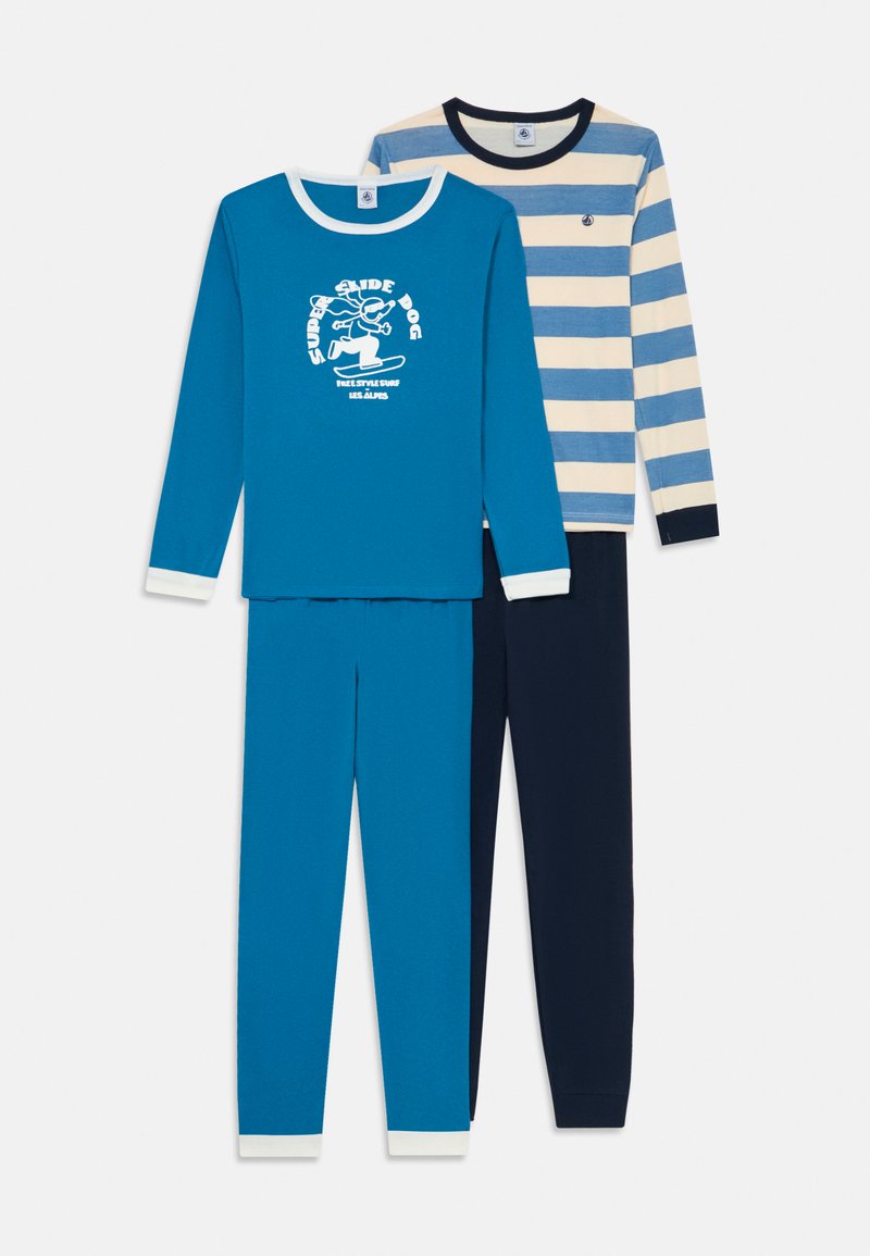 Two sets of children’s pajamas: a turquoise long-sleeve top with white cuffs and a graphic, and navy striped top with matching pants.
