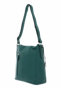 Sac à épaule en cuir teal avec texture lisse, bandoulière réglable unique et poche zippée extérieure. Design simple avec des accents en matériel minimal.