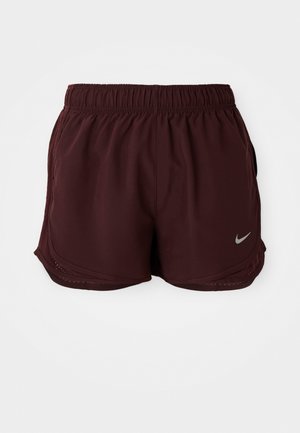 Pantaloni sportivi bordeaux con vita elastica, tasche laterali e orlo curvo. Presentano un piccolo logo Nike grigio in basso a destra.