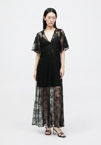 Maje REXYELLE - Maxikjoler - noir