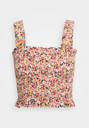 Top sin mangas y corto con tirantes anchos y un estampado floral multicolor recogido en rojo, rosa, amarillo y azul marino sobre fondo blanco.