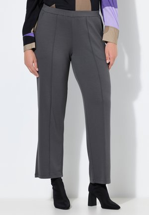 - Spodnie materiałowe