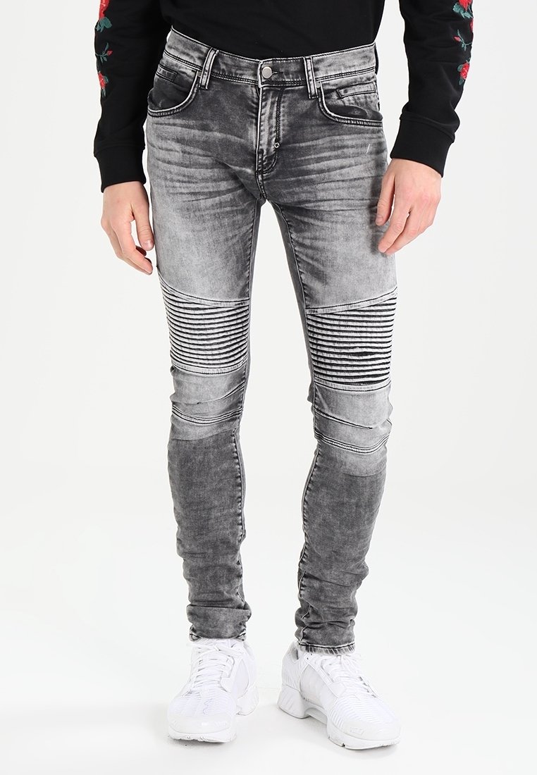 Šedé skinny džíny s horizontálním pruhovaným vzorem na kolenou, s vintage detaily, pěti kapsami a stříbrným kováním.