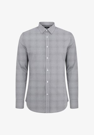 Koszula z długim rękawem w czerni i bieli z okrągłym wzorem, z kołnierzykiem zapinanym na guziki oraz z przodu na guziki. Tkanina z mieszanki bawełny.