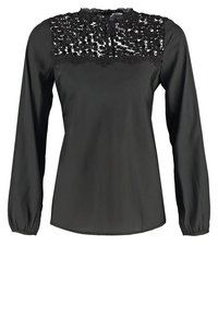 Blouse noire à manches longues avec un empiècement en dentelle texturée. Tissu lisse, col arrondi et manches froncées pour un ajustement décontracté.