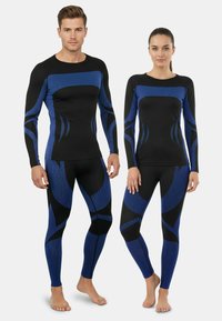 Black and blue athletic wear featuring long sleeves and fitted design, with textured fabric and a geometric pattern across the torso and legs.