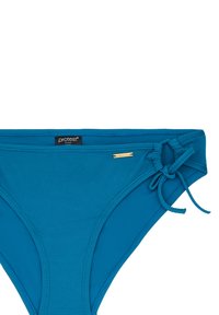 Turquoise bikini donji dio s teksturiranim materijalom, detaljem vezanja s strane i malom zlatnom oznakom. Dizajniran za udobnost i prilagodbu.