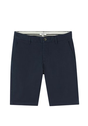 Shorts en coton bleu marine avec une fermeture à bouton, deux poches avant et un design classique. Dotés d'une ceinture intérieure rayée.