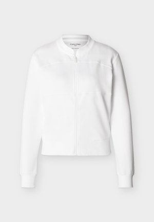 Λευκό μπουφάν με φερμουάρ, με ριμπ γιακά, μανσέτες και τελείωμα, διακοσμημένο με διακριτικές ραφές και εφαρμοστή σιλουέτα.
