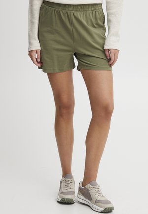 Olivenfargede shorts med elastisk midje, laget av pustende stoff. Avslappet passform med knelengde. Lett og glatt tekstur.