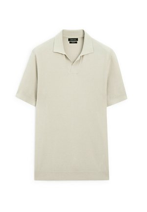 Ljusbeige polo med strukturerad stickad design, korta ärmar och V-halsringning. Enkel och minimalistisk stil.
