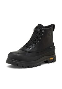 Svart höga skinnkänga med tjock Vibram-sula, metallöglor och Gore-Tex-märke på sidan.