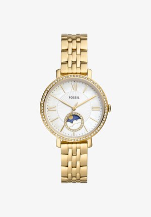 Gold Fossil wristwatch with mother-of-pearl face, Roman numerals, crystal bezel, and a subdial showing sun and cloud moon phase design.