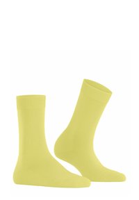 Żółte bawełniane skarpetki z prążkowanymi mankietami i gładką teksturą. Charakteryzują się wzmocnionym palcem i piętą, idealne dla komfortu i trwałości.