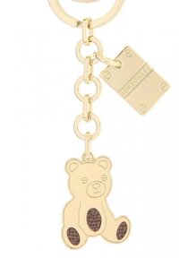 Portachiavi dorato con un ciondolo a forma di orso accentato da dettagli marroni. È attaccata una targhetta rettangolare con il marchio "Borbonese".