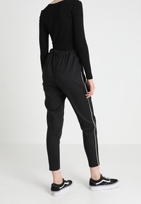 Jennyfer Trousers - black