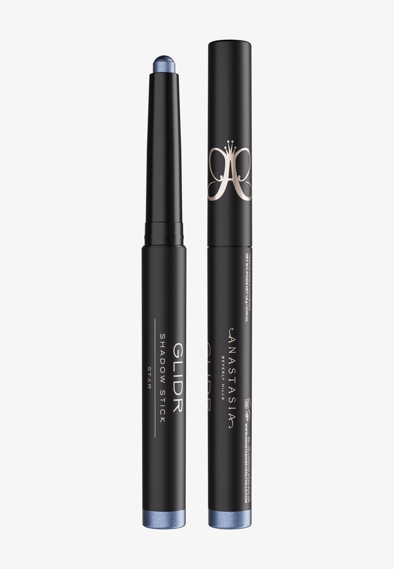 Black retractable eyeshadow stick with metallic blue tip and matching cap, labeled "GLIDR Shadow Stick Star" and "Anastasia Beverly Hills."