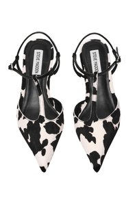 Décolleté slingback in pelle bovina bianca e nera. Presenta una sottile cintura nera e una soletta in pelle con etichetta del marchio. Superficie liscia e strutturata.