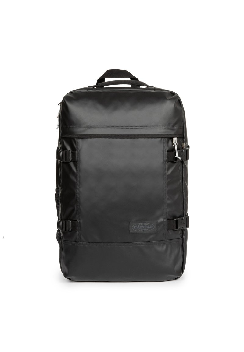 Musta reppu, joka on valmistettu sileästä ja kestävästä materiaalista. Varustettu säädettävillä hihnoilla, etupuolen vetoketjutaskulla ja ylimmällä kantokahvalla.