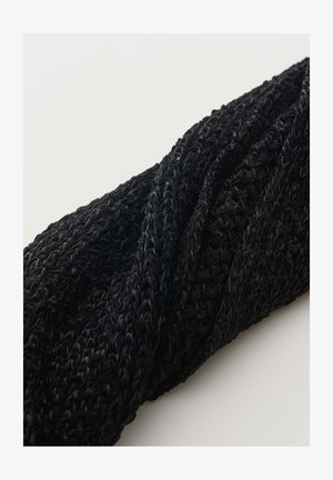 Black knitted headband with a textured pattern, twisted in the center, displayed on a plain white background.