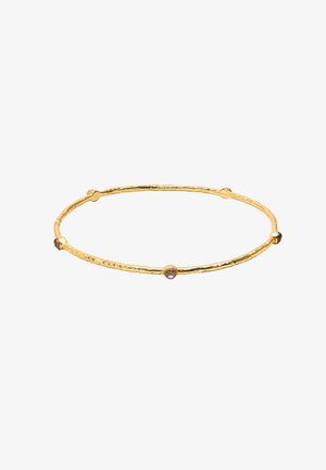 Złota bransoletka o fakturowanej, nierównej powierzchni, z trzema małymi, okrągłymi kamieniami akcentującymi. Lekka i okrągła w kształcie.