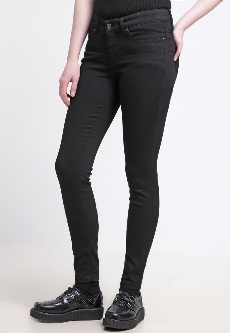 Sorte skinny jeans laget av denim, med en glatt tekstur, klassisk fem-lomme design, og solid knapp- og glidelås-lukking.