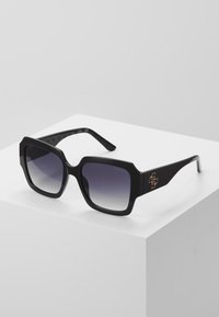 Guess Aurinkolasit - black