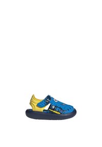 Blue and yellow children's sandals with a textured upper, cutouts for breathability, and a rubber sole. Features playful eye design.