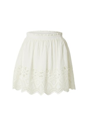 White cotton skirt with a gathered waistband, featuring intricate embroidered cutouts along the hem in a scalloped pattern.