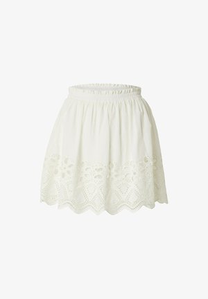 White cotton skirt with a gathered waistband, featuring intricate embroidered cutouts along the hem in a scalloped pattern.