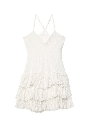White, sleeveless dress with a v-neck design, featuring a textured fabric and layered ruffle hem. Adjustable straps with metal hardware accents.