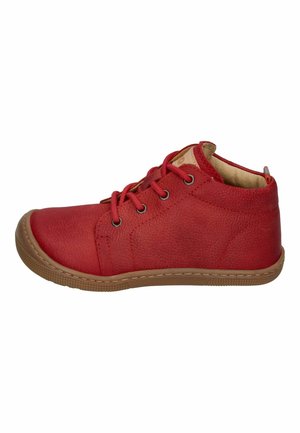 Red leather mid-top shoe with lace-up front, padded collar, and textured tan rubber sole.