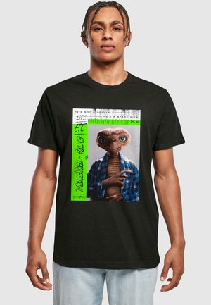 Black cotton t-shirt featuring a graphic of E.T. in a blue plaid shirt, surrounded by white and neon green text and accents.
