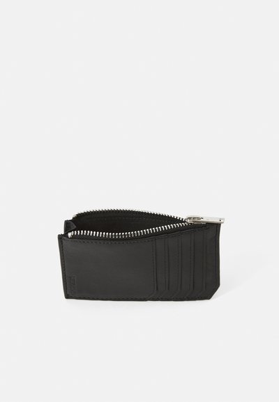 Black leather wallet with a zip closure, featuring six card slots and a textured surface. Compact design with silver hardware accents.