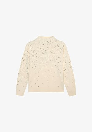 Kremowy sweter z wysokim kołnierzem i długimi rękawami, ozdobiony rozproszonymi czarnymi i srebrnymi zdobieniami na plecach. Miękka w dotyku.