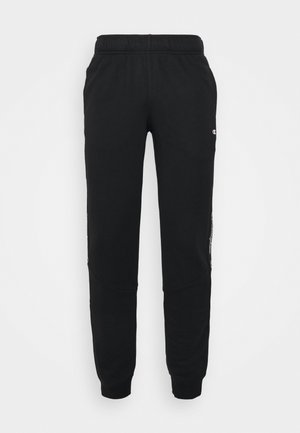 CUFF - Tracksuit bottoms - black