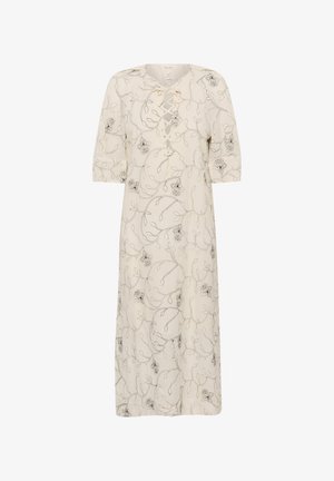 Lněné šaty s šněrovacím výstřihem, krátkými rukávy a černou květinovou výšivkou na krémovém pozadí; střední délka a volný střih.