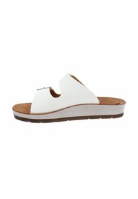 Ciabatta bianca con doppie cinghie, soletta in sughero, suola a zeppa leggera e suola in gomma strutturata. Design semplice e pulito con accenti metallici.