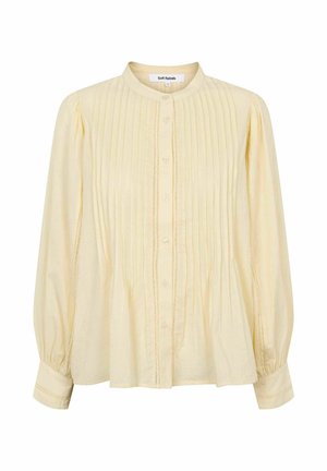 Bluză pal galbenă cu mâneci lungi, cu pliuri verticale, guler rotund și fâșie cu nasturi, având mâneci adunate și detalii subtile de cusături.