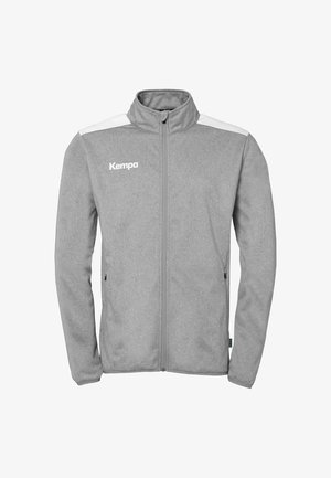 Grijze zip-up jack van zachte stof. Beschikt over witte schouderaccenten en een staande kraag. Inclusief zijzakken voor opberging.