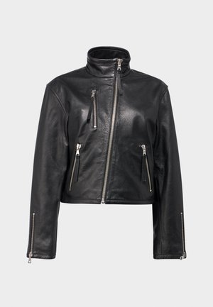Black leather cropped jacket with a high collar, featuring multiple silver zippered pockets and zip closures on the sleeves. Textured finish.