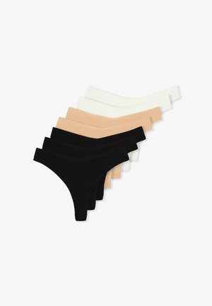 Stringtangas in zwart, beige en wit, gemaakt van een gladde, rekbare stof met een low-rise ontwerp en een minimalistische vorm.