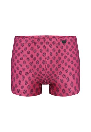 Rote Herren-Boxershorts mit unregelmäßigem schwarzem Tupfenmuster und kleinem Stoffmarkenetikett am Bund.