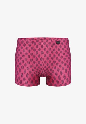 Rote Herren-Boxershorts mit unregelmäßigem schwarzem Tupfenmuster und kleinem Stoffmarkenetikett am Bund.