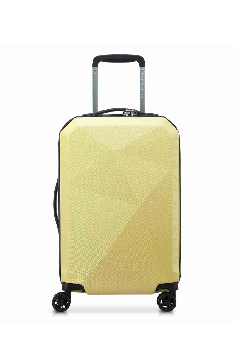 Valigia rigida di colore giallo chiaro con un motivo geometrico, dotata di manico telescopico, ruote girevoli e chiusura con zipper.