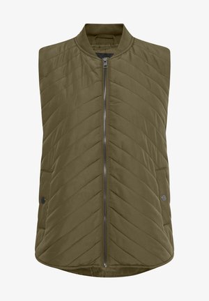 Oluvzaļa, siltināta bez piedurknēm veste ar iegriešanu priekšā, divām sānu kabatām un ribotām apkaklēm. Ar chevron šuvju rakstu.