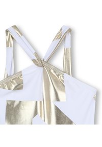 Costume da bagno bianco con motivi a stella metallici dorati, con spalline regolabili che si attorcigliano e si annodano sul retro per una vestibilità sicura.