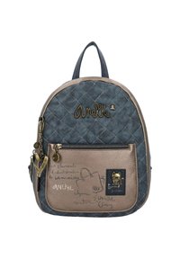 Gesteppten blauen Stoff-Rucksack mit einer bronzefarbenen Vorderseite, dekorativen Beschlägen, Logo-Details und künstlerischen Skizzen. Zwei verstellbare Träger.